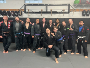 Congratulations! Navy Vet Jesse Jay Smith (center back) was just promoted to black belt. Dave Dempsey (right of Jesse was also promoted to black belt. Dave is on the board of directors for Foxhole and currently serving in the Navy. Finally, Navy Vet Scott Houlihan (far left) was promoted to brown belt. 